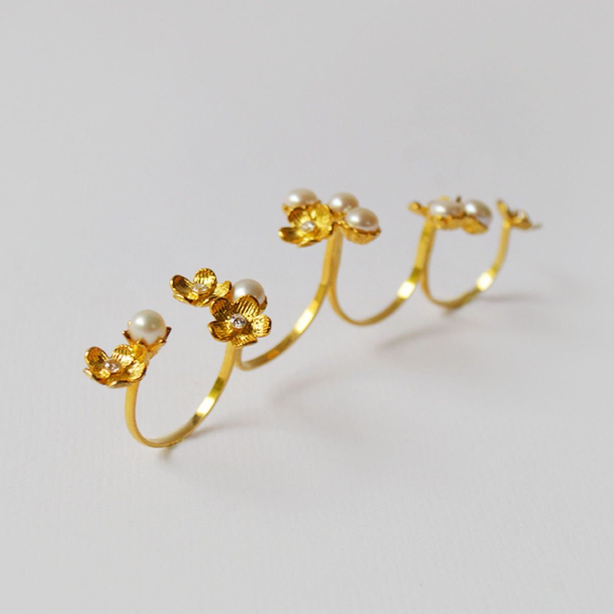Lei Garden knuckle ring with Zircons and Pearls, from the Lei collection.