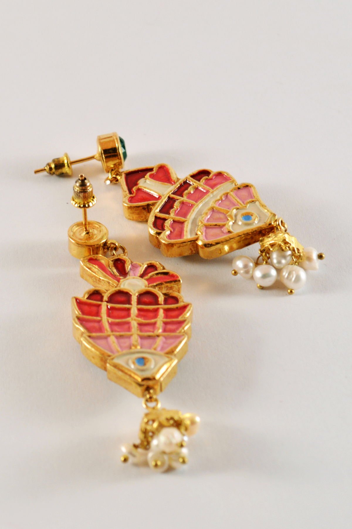 Detail view of the fish Earrings with emerald tops, from the Safari collection.