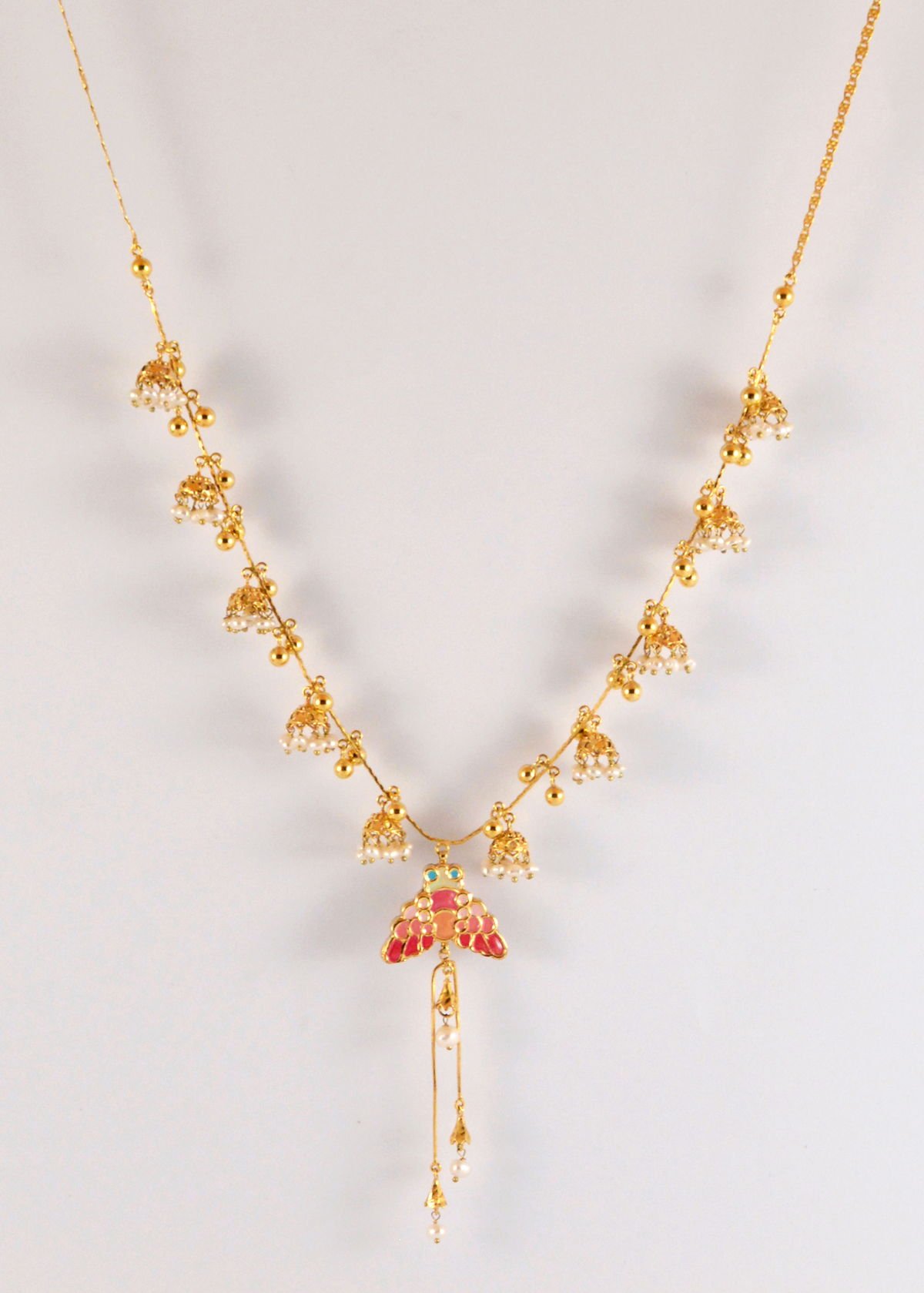 Wasp necklace with pearl jhumki necklace, Kundan and enameled front and back, from the Safari collection.