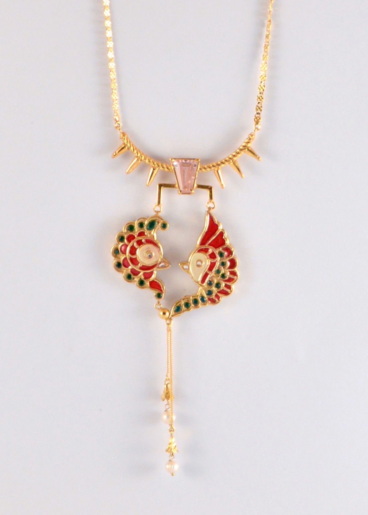 Asymmetric Bird necklace with kundan and enamel detail and pink zircon, from the Safari collection.